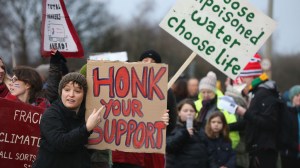 SALFORD, ENGLAND - JANUARY 26: Environmental campaigners take part in a protest march near to the IGas Barton Moss fracking exploration rig on January 26, 2014 in Salford, England. Environmental protestors and anti gas fracking campaigners from across Britain marched to the Barton Moss gas exploration site run by Energy company IGas from Salford City Stadium. (Photo by Christopher Furlong/Getty Images)